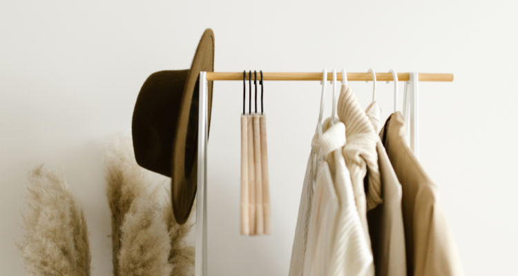 Clothing rack with hat and wooden hangers