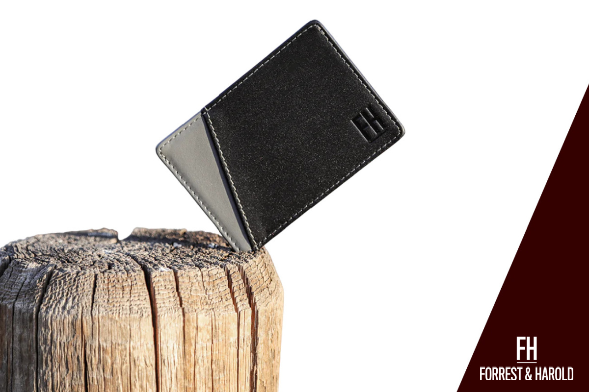 Photo showig how slim a Forrest & Harold wallet is. It can fit even in between cracks of a tree stump used for chopping logs. F&H wallets are made of durable material and are designed for the convenience of the modern men.